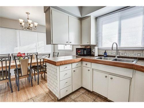 25 Rossmount Road Sw, Calgary, AB - Indoor Photo Showing Kitchen With Double Sink