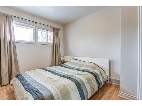 25 Rossmount Road Sw, Calgary, AB - Indoor Photo Showing Bedroom