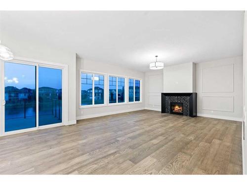 25 Stillwater Bay, Heritage Pointe, AB - Indoor Photo Showing Living Room With Fireplace