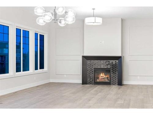 25 Stillwater Bay, Heritage Pointe, AB - Indoor Photo Showing Living Room With Fireplace