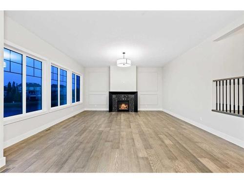 25 Stillwater Bay, Heritage Pointe, AB - Indoor Photo Showing Living Room With Fireplace