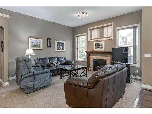 1026 Williamstown Boulevard Nw, Airdrie, AB - Indoor Photo Showing Living Room With Fireplace