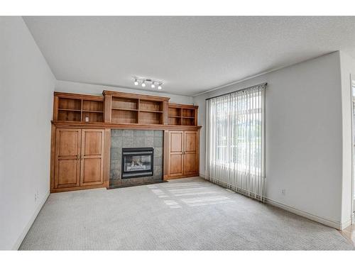 133 Evergreen Plaza Sw, Calgary, AB - Indoor Photo Showing Other Room With Fireplace