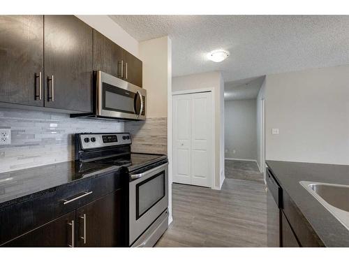 1335-81 Legacy Boulevard Se, Calgary, AB - Indoor Photo Showing Kitchen With Stainless Steel Kitchen