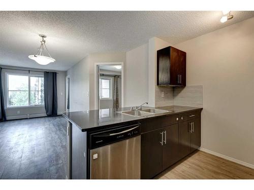 1335-81 Legacy Boulevard Se, Calgary, AB - Indoor Photo Showing Kitchen With Double Sink