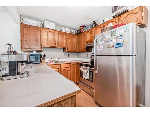 252 Shawinigan Drive Sw, Calgary, AB - Indoor Photo Showing Kitchen With Double Sink