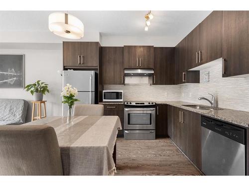 207-4 Sage Hill Terrace Nw, Calgary, AB - Indoor Photo Showing Kitchen With Stainless Steel Kitchen With Upgraded Kitchen