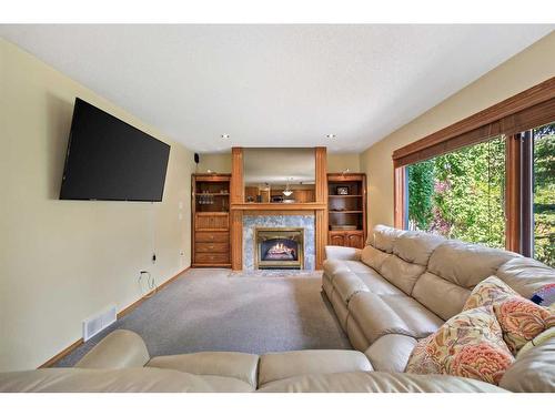 75 Schubert Hill Nw, Calgary, AB - Indoor Photo Showing Living Room With Fireplace