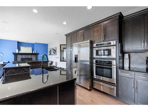 290 Kingsbury View Se, Airdrie, AB - Indoor Photo Showing Kitchen With Stainless Steel Kitchen With Double Sink