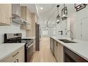 322 Sage Hill Circle Nw, Calgary, AB  - Indoor Photo Showing Kitchen With Stainless Steel Kitchen With Double Sink With Upgraded Kitchen 