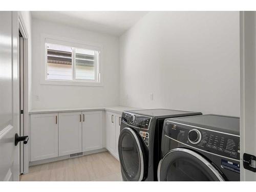 65 Rowmont Link Nw, Calgary, AB - Indoor Photo Showing Laundry Room