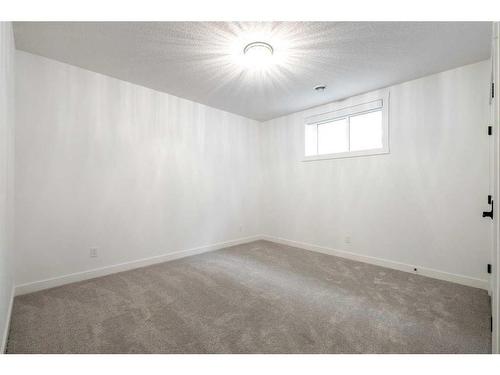 65 Rowmont Link Nw, Calgary, AB - Indoor Photo Showing Other Room