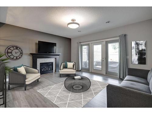 280 Masters Cove Se, Calgary, AB - Indoor Photo Showing Living Room With Fireplace