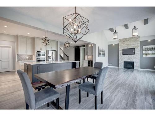 280 Masters Cove Se, Calgary, AB - Indoor Photo Showing Dining Room With Fireplace