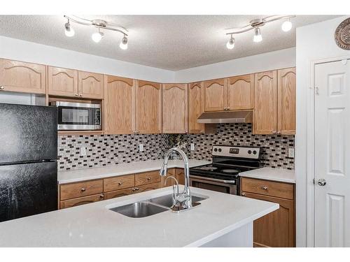 42 Evansford Grove Nw, Calgary, AB - Indoor Photo Showing Kitchen With Double Sink