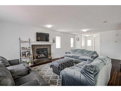 42 Evansford Grove Nw, Calgary, AB - Indoor Photo Showing Living Room With Fireplace