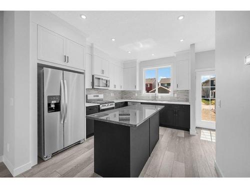 27 Amblefield Avenue Nw, Calgary, AB - Indoor Photo Showing Kitchen With Upgraded Kitchen