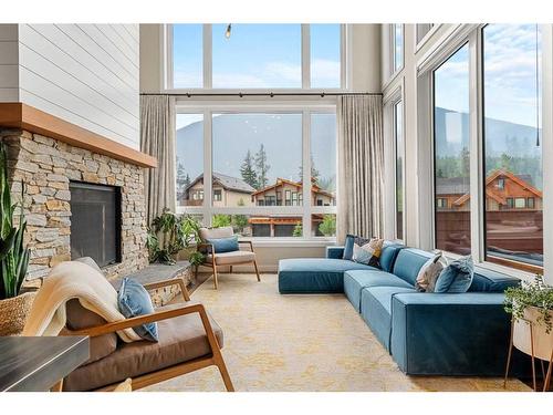 414 Stewart Creek Close, Canmore, AB - Indoor Photo Showing Living Room With Fireplace