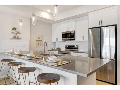 104-245 Edith Place Nw, Calgary, AB - Indoor Photo Showing Kitchen With Upgraded Kitchen