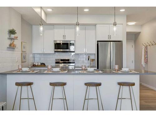 104-245 Edith Place Nw, Calgary, AB - Indoor Photo Showing Kitchen With Double Sink With Upgraded Kitchen