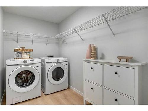 104-245 Edith Place Nw, Calgary, AB - Indoor Photo Showing Laundry Room