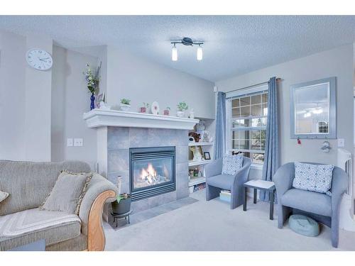 157-7707 Martha'S Haven Park Ne, Calgary, AB - Indoor Photo Showing Living Room With Fireplace