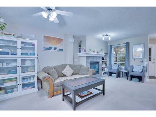 157-7707 Martha'S Haven Park Ne, Calgary, AB - Indoor Photo Showing Living Room With Fireplace