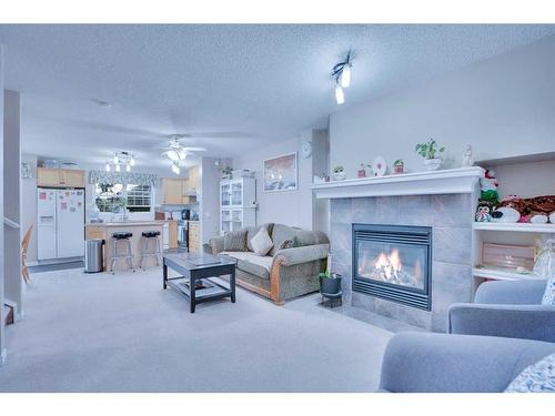 157-7707 Martha'S Haven Park Ne, Calgary, AB - Indoor Photo Showing Living Room With Fireplace