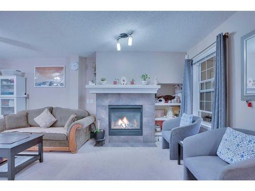 157-7707 Martha'S Haven Park Ne, Calgary, AB - Indoor Photo Showing Living Room With Fireplace