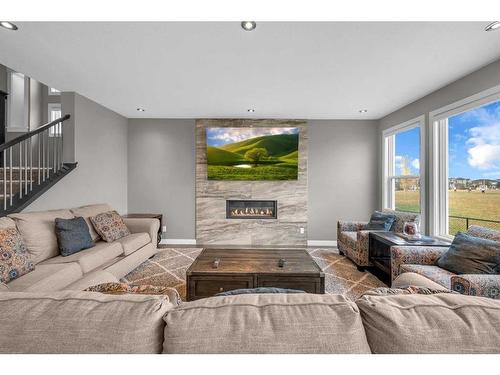 134 Red Sky Green Ne, Calgary, AB - Indoor Photo Showing Living Room With Fireplace