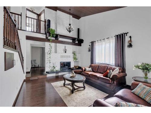 391 Edenwold Drive Nw, Calgary, AB - Indoor Photo Showing Living Room With Fireplace