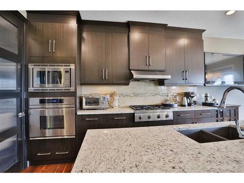 31 Sage Bank Place Nw, Calgary, AB - Indoor Photo Showing Kitchen With Stainless Steel Kitchen With Double Sink With Upgraded Kitchen