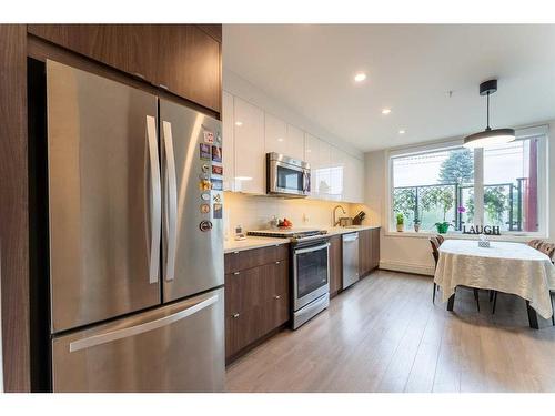 204-1526 9 Avenue Se, Calgary, AB - Indoor Photo Showing Kitchen With Stainless Steel Kitchen