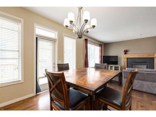 40 Copperstone Gate Se, Calgary, AB - Indoor Photo Showing Dining Room With Fireplace
