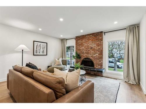 8223 4A Street Sw, Calgary, AB - Indoor Photo Showing Living Room With Fireplace