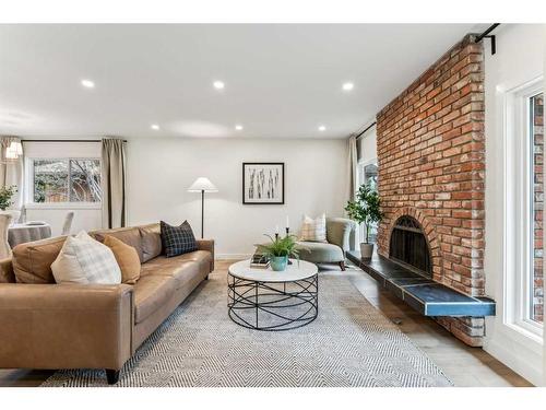 8223 4A Street Sw, Calgary, AB - Indoor Photo Showing Living Room With Fireplace