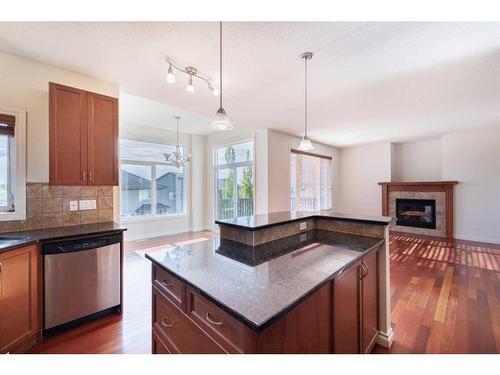 368 Evanspark Circle Nw, Calgary, AB - Indoor Photo Showing Kitchen With Fireplace