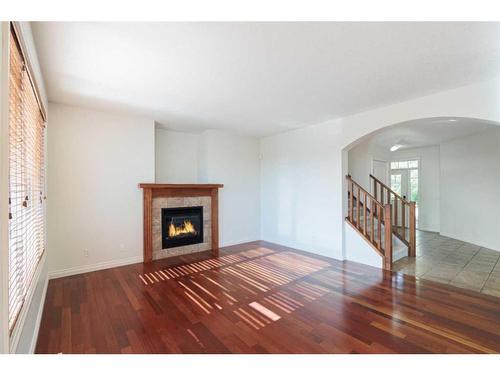 368 Evanspark Circle Nw, Calgary, AB - Indoor Photo Showing Living Room With Fireplace