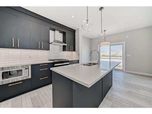 544 Walgrove Boulevard Se, Calgary, AB - Indoor Photo Showing Kitchen With Double Sink With Upgraded Kitchen