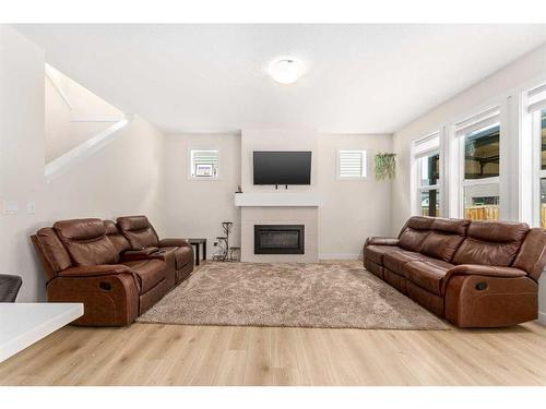 1167 Copperfield Boulevard Se, Calgary, AB - Indoor Photo Showing Living Room With Fireplace