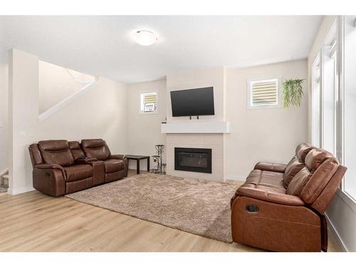 1167 Copperfield Boulevard Se, Calgary, AB - Indoor Photo Showing Living Room With Fireplace