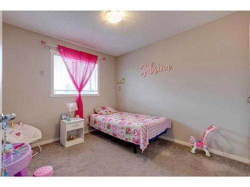 17 Silverado Drive Sw, Calgary, AB - Indoor Photo Showing Bedroom