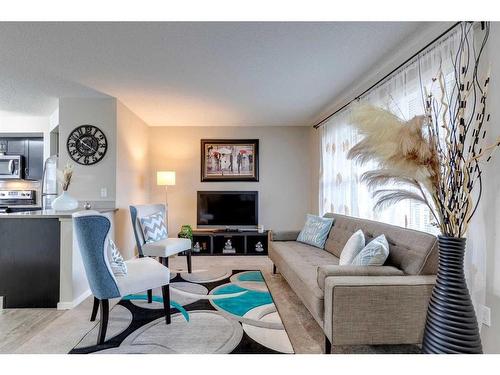 17 Silverado Drive Sw, Calgary, AB - Indoor Photo Showing Living Room