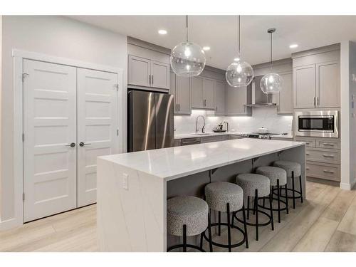 102-55 Wolf Hollow Crescent Se, Calgary, AB - Indoor Photo Showing Kitchen With Stainless Steel Kitchen With Upgraded Kitchen