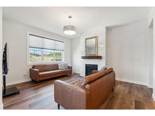 20 Willow Park Point, Cochrane, AB - Indoor Photo Showing Living Room With Fireplace