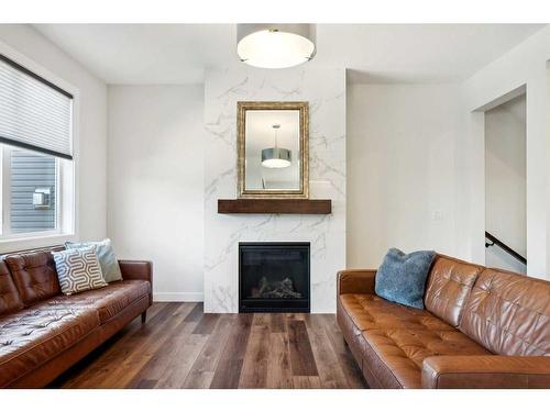 20 Willow Park Point, Cochrane, AB - Indoor Photo Showing Living Room With Fireplace