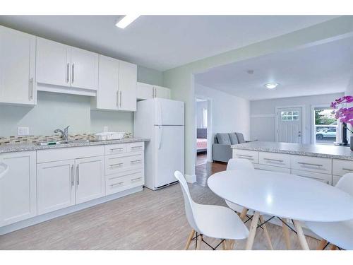 829 3 Avenue West, Drumheller, AB - Indoor Photo Showing Kitchen With Double Sink