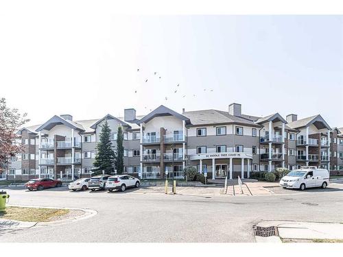 308-92 Saddletree Court Ne, Calgary, AB - Outdoor With Balcony With Facade