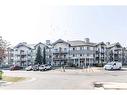 308-92 Saddletree Court Ne, Calgary, AB  - Outdoor With Balcony With Facade 