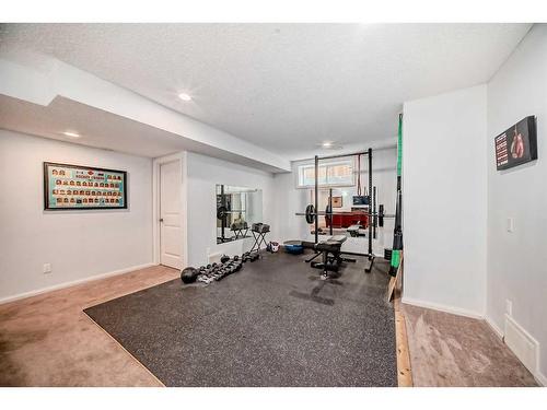 56 Reunion Close Nw, Airdrie, AB - Indoor Photo Showing Gym Room